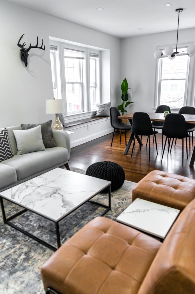 Photo by Andrea Davis white and black table near white couch