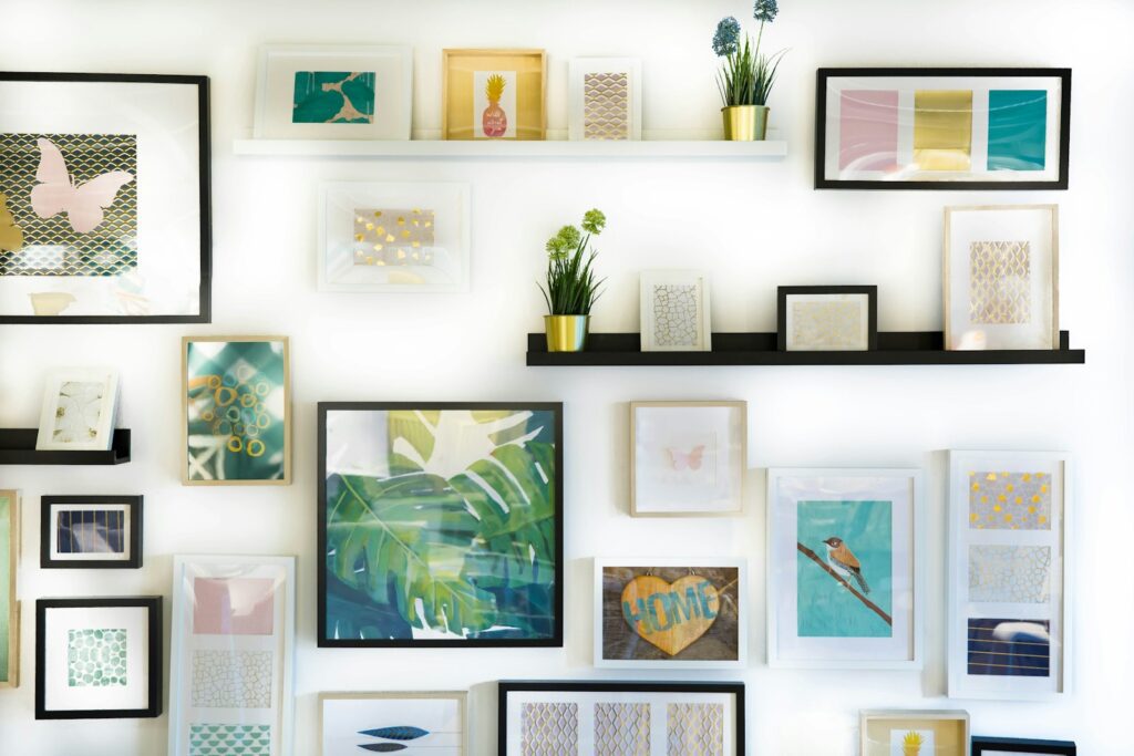 Photo by Jonny Caspari assorted-color framed paintings on the wall