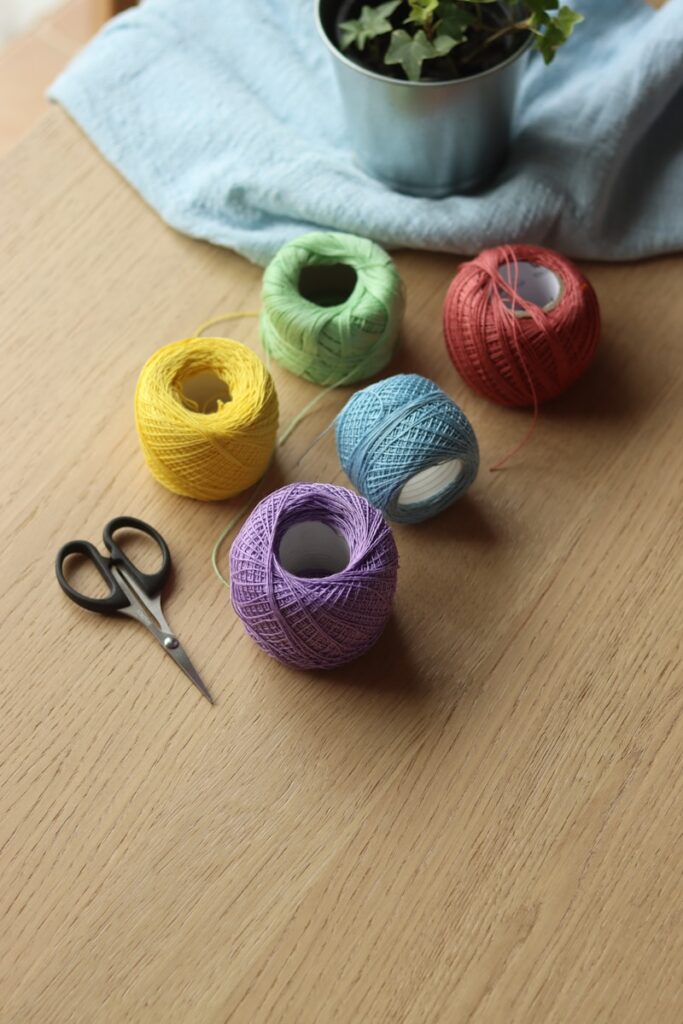 Photo by Daniela red yellow and green yarn